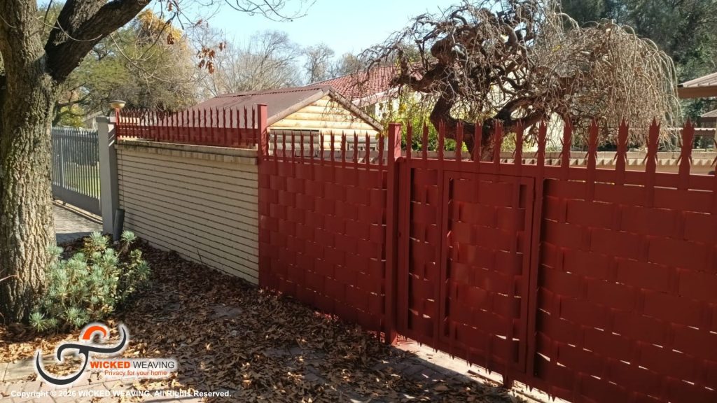30m Terracotta Palisade Weaving Installation in Sasolburg