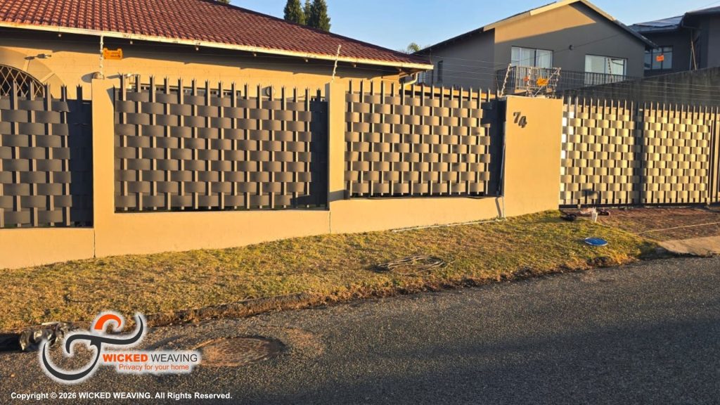 25m Charcoal Palisade Weaving Installation Completed in Sydenham, Johannesburg