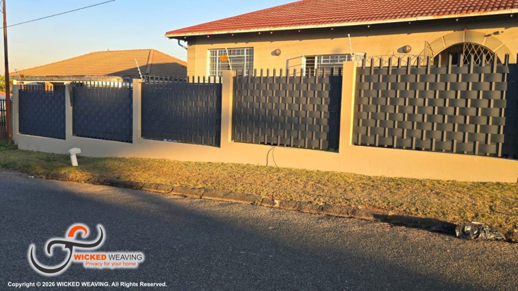 25m Charcoal Palisade Weaving Installation Completed in Sydenham, Johannesburg
