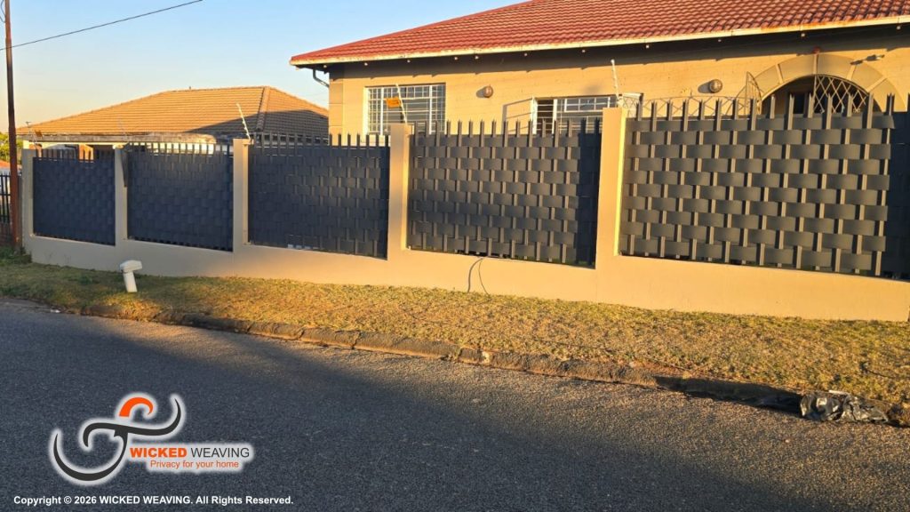 25m Charcoal Palisade Weaving Installation Completed in Sydenham, Johannesburg